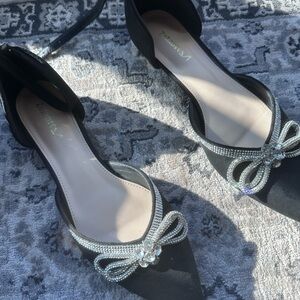 Vaneli Black Flats with Silver Bow Accents